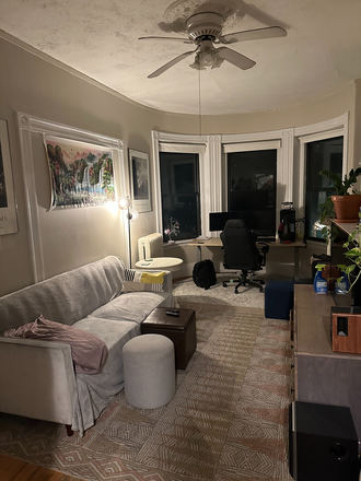 Living Room, including bay windows and decorative fireplace - 600+SQFT 1 Bedroom Apartment