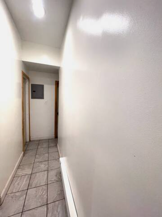 Hallway - First Floor - One bedroom, Living room, Kitchen, bathroom, and small backyard Townhome