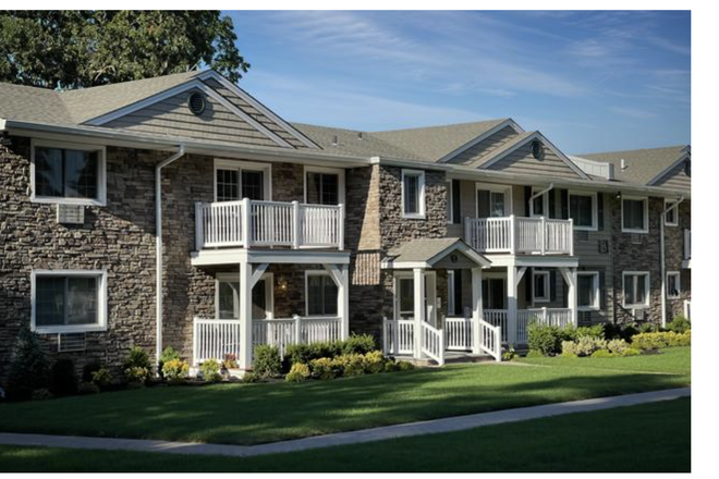 This is a full view of the house, showing its exterior and surrounding landscape. - FAIRFIELD LAKE GROVE Apartments