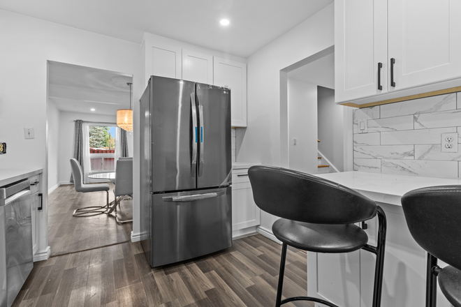 Kitchen with Bar Stools (New Appliances) - 3 Separate Rooms Available in a Shared Townhouse - Unfurnished with Laundry