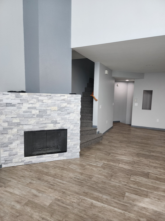 Fire place living area and dinning view - Great Midtown location. Condo offers 2 split-bedroom layout with two full baths.