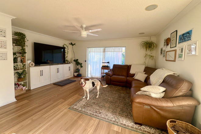 living room - Seeking roommate to share townhouse. Bedroom and private bath available in quiet community with pool