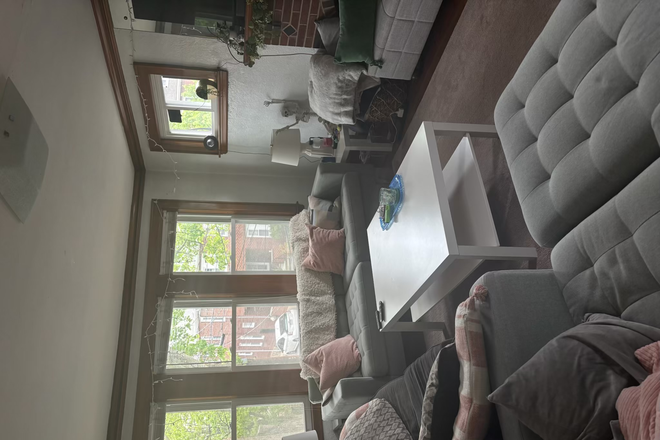 Living Room (open floor plan!) - 2 bedrooms available in a 3 bedroom apartment! Super close to campus!