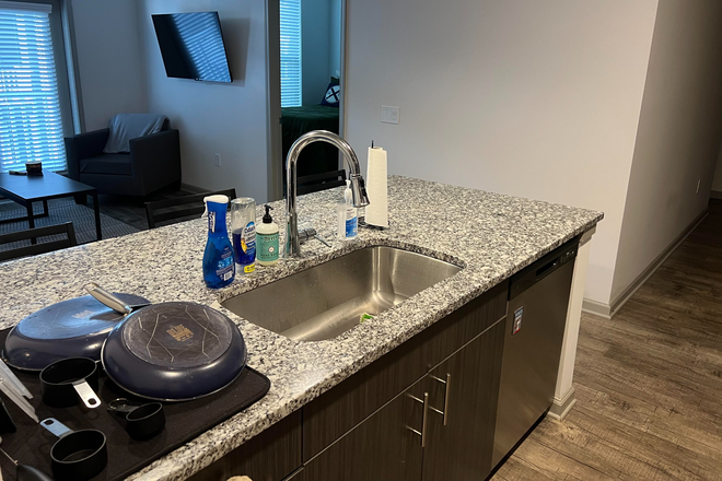 Kitchen bar / a bedroom door - The Beacon Apartments