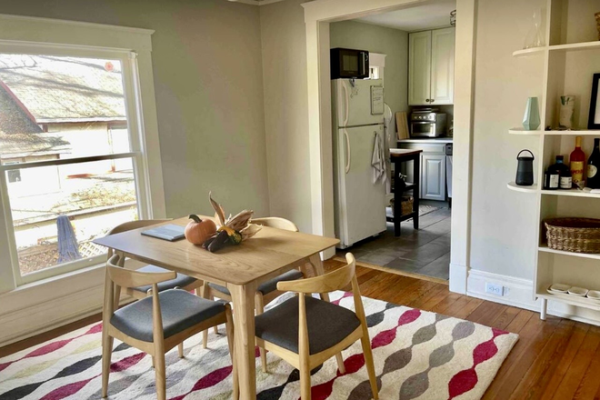 Newer table, 4 chairs. Archway to kitchen on one side and archway to living room on other. Feels light and spacious. - Treetop views, 2nd floor in beautiful remodeled historic house, private entrance