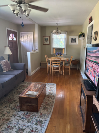 Living room/dining with tv, electric fireplace fully furnished - Fully furnished 2 bedroom house. $1800 plus utilities. Nearby bus stop and train.