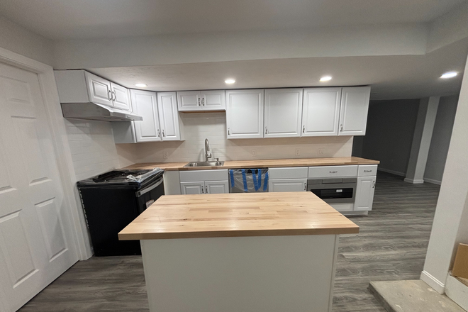 Kitchen - Newly renovated modern 2-3 bedroom apartment New premium appliances AC 2 full baths Storage