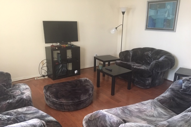 Living room - Furnished Bedroom in BEAUTIFUL Fort Hill! Townhome