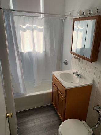 Visit hubrealtyproperties.com - Sunny 1 bedroom with fully applianced kitchen, upper floor, heat included, laundry on site Apartments