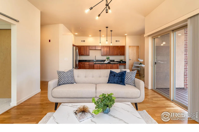 LR into Kitchen (Some furniture has been changed) - Large primary bedroom with private bath in modern, light Louisville condo