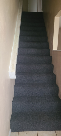 stairway to go from living room to bedroom upstairs - Mid -Town apartment for Rent