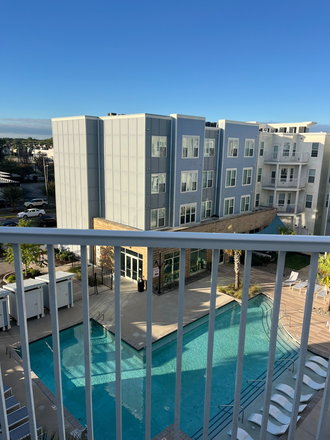 Balcony Overlooking Pool - Uncommon Wilmington Apartments