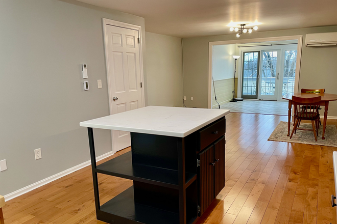 Living/Dining Room Sunroom in back - 2 BR Townhouse in quiet wooded neighborhood near UMass & Amherst College