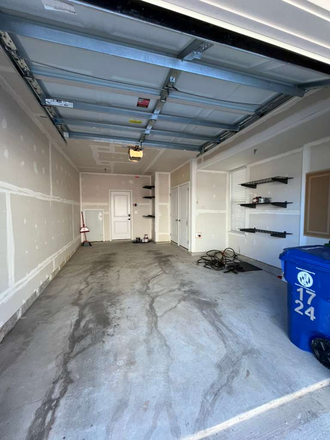 one car garage and an outside parking spot outside of garage - Luxury New Construction + Private Garage - Steps from Johns Hopkins  Hospital Townhome