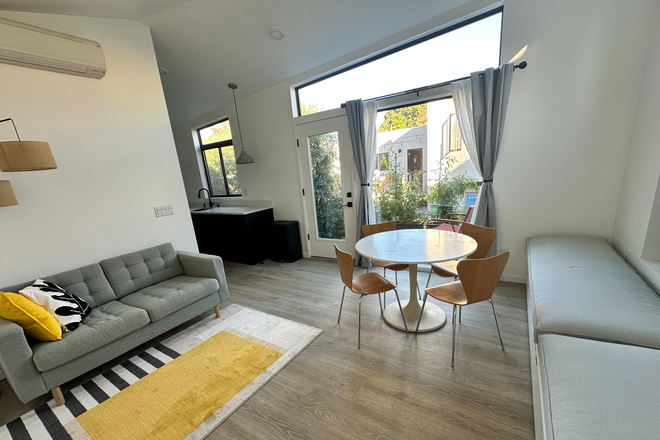 Living and dining area - Private, modern one-bedroom ADU in garden setting in West Berkeley