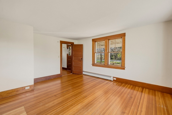 Front room - Quaint 1915 Farmhouse.  Unfurnished 4 bedrooms, workshop/office, 2 baths. Close to bus route.
