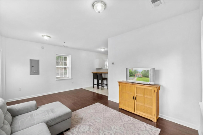 Living room - 4BR/1BA Converted Firehouse Near UMD – Free Driveway Parking & Metro Access