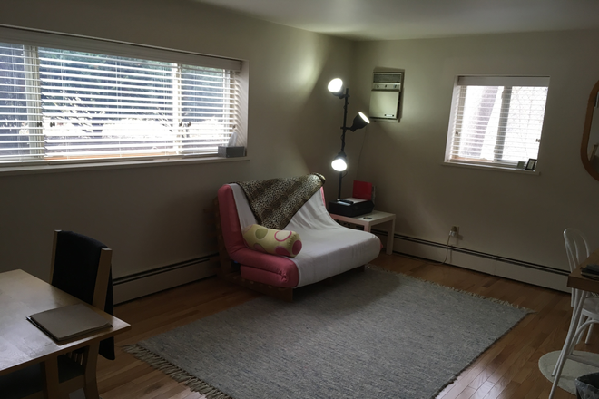 Living room with sofa. Note real red oak hardwood floors - Downtown Ann Arbor, Private Cul-de-Sac, Small Private Building, Mature Tenants, Lots of Parking Apartments