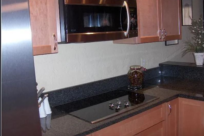 Kitchen features - 3 bd/2 bath great location- huge balcony and IN UNIT washer and dryer! Condo