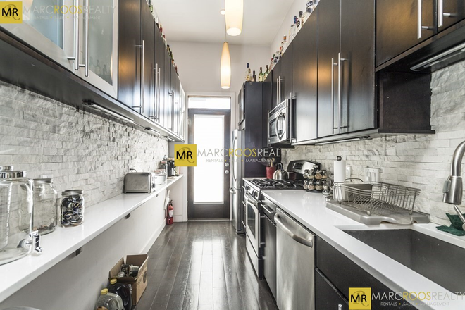 Call call or text Arezou at 617-584-7817 - Penthouse living in Brigham Circle! This top 2 floor duplex in a historic Brownstone building