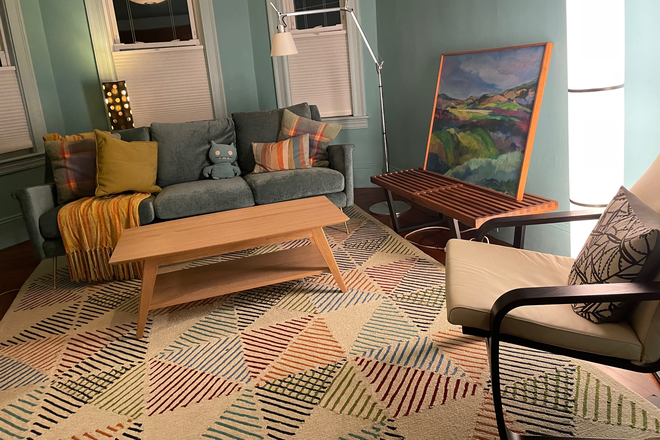 Living room - Furnished Cambridge top floor condo 1/2 block from Mass. Ave., walking distance to Davis Square