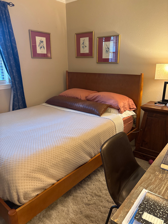 Bed with mini fridge, coffee maker, and full-size closet - Stylish Bedroom  in Fully Furnished- Everything Included House