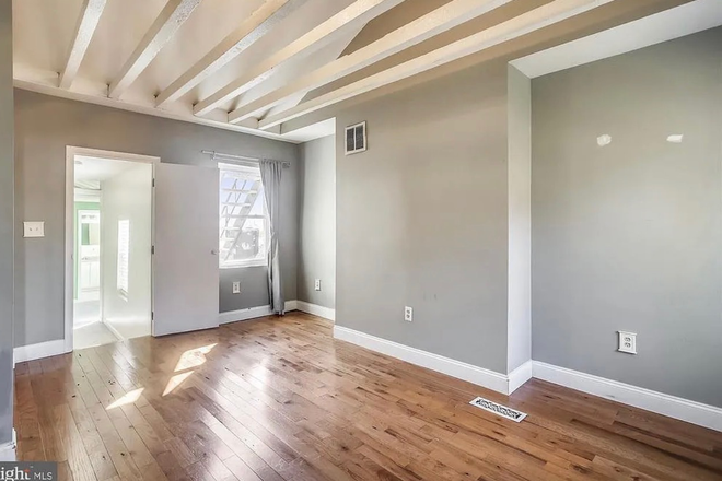 Back wall of bedroom (paint has been redone!) - Room for rent close to JHH Townhome