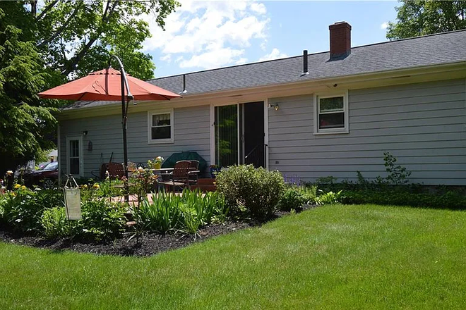 back patio in summer time - 3 Bedroom 1 Bathroom House in East Providence