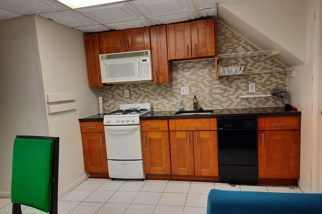 Kitchen/Common area, View 1/2 - One Room In Furnished 2 BR 1 BA English Basement Unit,  Available Immediately for Sublet or Lease Townhome