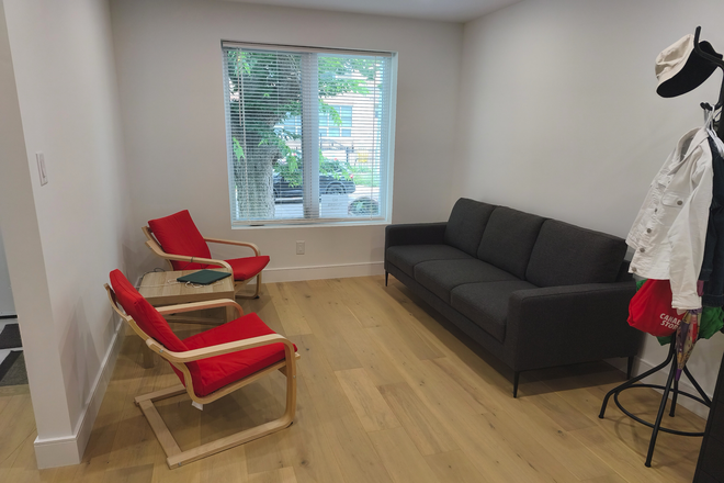 Living room - ground floor - coffee table to come in front of the sofa - workspace to come beside the sofa - Furnished 3-Bed, 1.5-Bath New-build Home in Danforth Village - Steps to Greenwood Stn, Util Incl