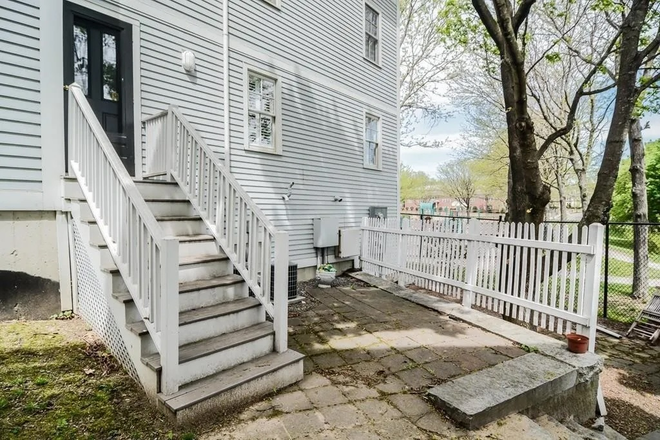 Rear Patio - Live in the heart of Arlington Center at sought-after Russell Place Condominiums!