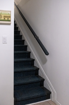 Stairs to private entryway and laneway. - Modern 2-bedroom suite with A+ transit access Townhome