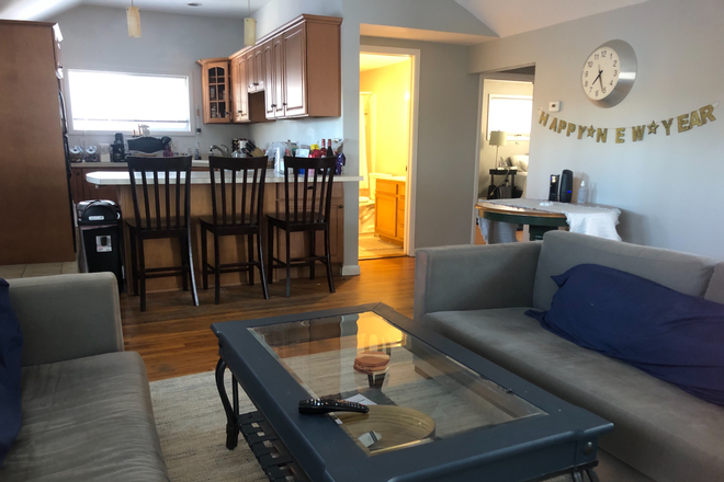 Living room with view to kitchen - Walk to Lake House