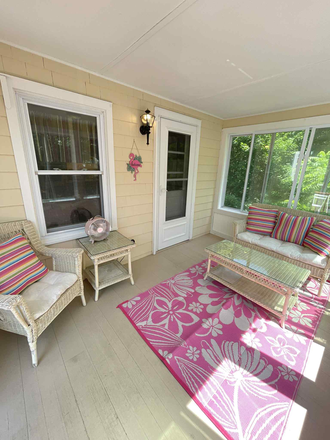 Sun porch with wicker furniture, bistro table, fan. - Cozy Westerly 2 bedroom House