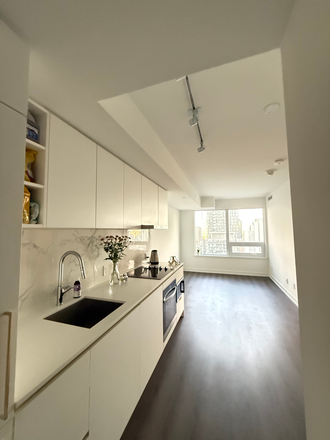 The living room and the kitchen - Modern Apartment, 2 bathrooms, stunning view, modern luxurious building (gym, study space, security)