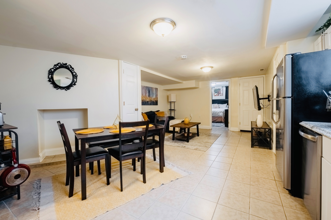 Living Room/Dining Room - Luxury, Pet-Friendly 1B/1B Apartment Available Near JHU Shuttle Stop & Penn Station