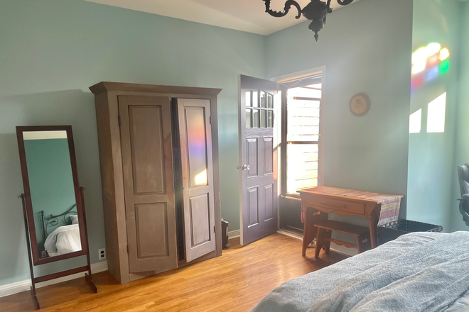 Bedroom- lots of morning sunlight:-) - Large Bedroom with Private Deck- Bright, Clean,  Furnished Room in Safe, Friendly Neighbourhood