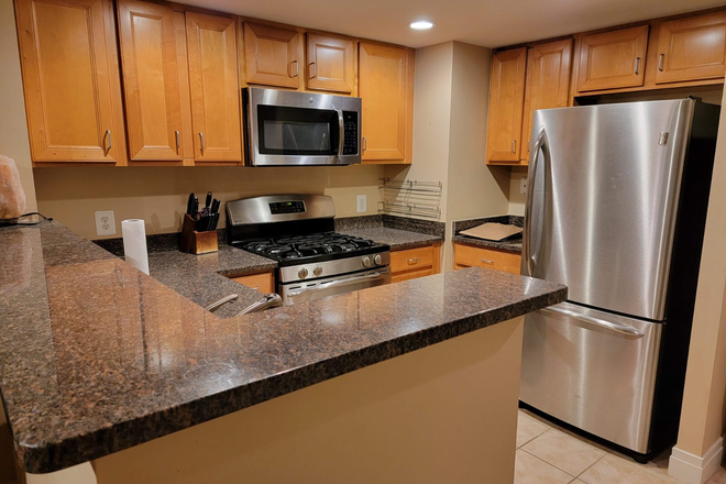 Sleek open-concept kitchen - Prime Downtown Location – Quick 7-Min Drive to UMB Condo