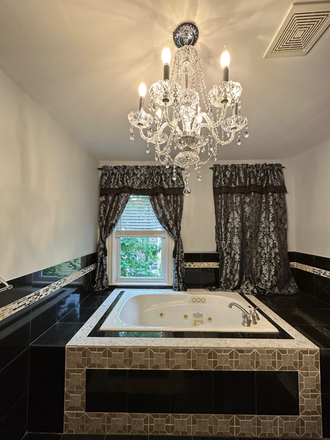 Bathroom with granite tiles and jacuzzi and separated shower - Must See: Clean, beautiful sun-lit floor through 1200 sqft. 1bed, 1bath with front & back porches