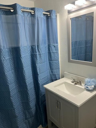 1 of 2 bathrooms - Alumni House Men's Residence