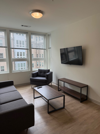 Living Room area - Landmark Apartments 4x2 Layout! Closest to Campus! Great Amenities