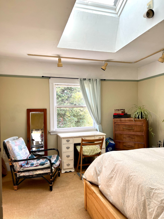 Huge skylight, operable, redwood out the window - Room with Large Skylight in Central Berkeley Victorian Garden Setting