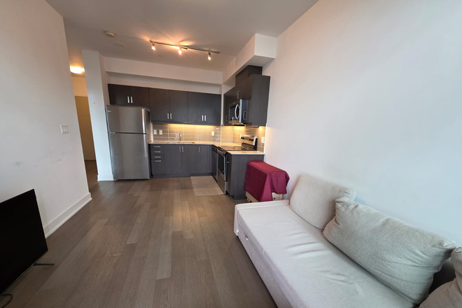 LIVING ROOM - 1 Bedroom + Den Semi Furnished Condo With Parking on same level at The Barrington
