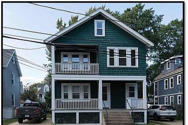 FRONT VIEW. NOTE: DRIVEWAYS ON BOTH SIDES OF HOUSE;   2 off-street tandem parking spaces for each unit. - Lower Allston sun drenched 3 bed/1 bath in 2F on dead-end street. large yard & parking. Apartments