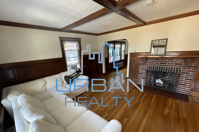 Living Room - **NOW RENTING JUNIOR YEAR 2026-2027**  LARGE 6 BED 3 BATH HOUSE - PORCH AND YARD - PARKING INCL -