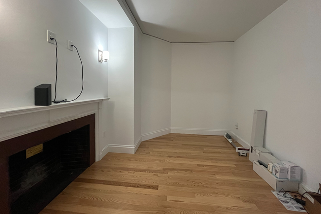 Living Room - Charming Unit in Historic Building with Modern Touches and Cozy Fireplace - All Utilities Included Apartments