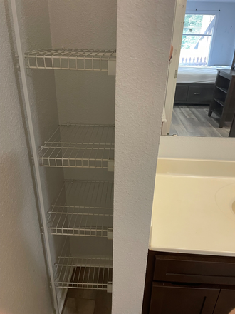 Bathroom closet - Studio West Apartments