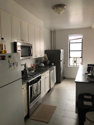 Open kitchen with 2 refrigerators - Large Bedroom in 7410 Ridge Blvd in Bay ridge Brooklyn near 77st subway station Apartments