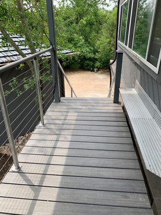 balcony looking towards stairs - Beautiful Garage Apartment.  Own front door.  Semi-furnished.