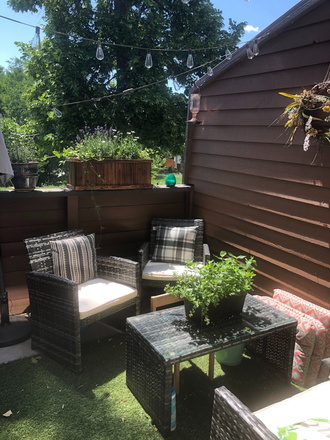 Back Porch (back garden area not shown) - Charming 2-3BR Across from Waneka Lake – Vaulted Ceilings, Basement, Garage Townhome